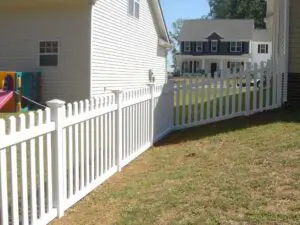 white fence near house